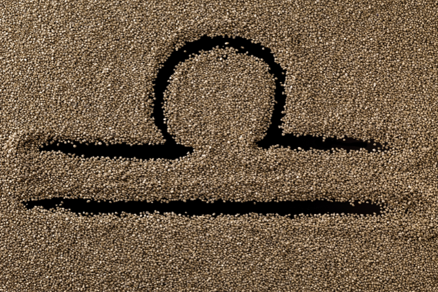 Símbolo de Libra desenhado na areia